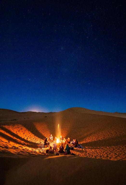 Spend Enchanting Evenings Around the Fire in the Heart of the Desert Enjoy a warm, unforgettable evening by the fire in the desert, with stories and songs from local Bedouins. The atmosphere is cozy and full of tradition